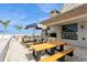 Enjoy outdoor grilling at picnic tables in this outdoor patio area overlooking the beach at 17900 Gulf Blvd # 1B, Redington Shores, FL 33708