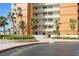 Well-maintained building exterior with landscaping, sidewalk, and reserved fire lane at 17900 Gulf Blvd # 1B, Redington Shores, FL 33708