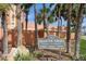 Redington Towers private residences community sign with palm trees on a sunny day at 17900 Gulf Blvd # 1B, Redington Shores, FL 33708