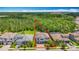 Aerial shot of a suburban home with a spacious backyard backing onto a wooded area at 18203 Pine Hammock Blvd, Lutz, FL 33548