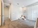 Cozy bedroom featuring plush carpeting, a large stuffed animal, and easy access to other rooms at 18203 Pine Hammock Blvd, Lutz, FL 33548