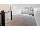 Spacious bonus room with neutral carpet and natural light from multiple windows at 18203 Pine Hammock Blvd, Lutz, FL 33548