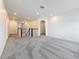 Second floor hallway with neutral carpet, access to multiple rooms, and bright, natural light at 18203 Pine Hammock Blvd, Lutz, FL 33548