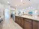 Spacious kitchen featuring a center island with granite countertops, and stainless steel appliances at 18203 Pine Hammock Blvd, Lutz, FL 33548