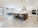 Modern kitchen with stainless steel appliances, large island, and pendant lighting at 18203 Pine Hammock Blvd, Lutz, FL 33548