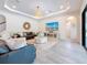 Comfortable living room featuring modern design and a large-screen television for entertainment at 18203 Pine Hammock Blvd, Lutz, FL 33548