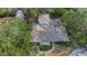 Overhead shot of a charming home with a detailed roof design and a tranquil backyard setting at 1905 Pine Tree Ln, Belleair Bluffs, FL 33770