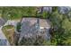 High-angle view of a home with a cozy balcony and serene surroundings, perfect for relaxation at 1905 Pine Tree Ln, Belleair Bluffs, FL 33770