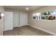 Inviting bedroom featuring stylish ceiling fan, light-colored walls, and a large window view at 1905 Pine Tree Ln, Belleair Bluffs, FL 33770