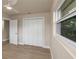 Spacious bedroom featuring light wood flooring, ceiling fan, and closet with double doors at 1905 Pine Tree Ln, Belleair Bluffs, FL 33770