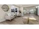Living room features an open floor plan and lots of natural light at 1905 Pine Tree Ln, Belleair Bluffs, FL 33770
