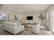 Bright living room area with neutral decor, recessed lighting and vinyl flooring at 1905 Pine Tree Ln, Belleair Bluffs, FL 33770