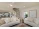 Living room features a decorative rug, recessed lighting, and an open floor plan at 1905 Pine Tree Ln, Belleair Bluffs, FL 33770