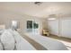 Bright main bedroom boasts lots of natural light and private balcony at 1905 Pine Tree Ln, Belleair Bluffs, FL 33770