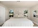 Bright main bedroom boasts lots of natural light and neutral decor at 1905 Pine Tree Ln, Belleair Bluffs, FL 33770