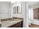 Bathroom with granite countertops, and tiled shower-tub at 21028 Ski Way, Land O Lakes, FL 34638