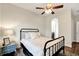 Comfortable bedroom with iron bed, an archway and an en suite bathroom at 21028 Ski Way, Land O Lakes, FL 34638