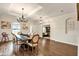 Spacious dining area with hardwood floors, wainscoting, modern lighting, and an adjacent office at 21028 Ski Way, Land O Lakes, FL 34638