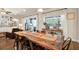 Open dining room with table and chairs plus living room with lots of natural light at 21028 Ski Way, Land O Lakes, FL 34638