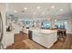 Open kitchen and living area features a large island with dishwasher and farmhouse sink at 21028 Ski Way, Land O Lakes, FL 34638