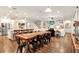 Spacious living room features hardwood floors, an open floor plan, and modern lighting at 21028 Ski Way, Land O Lakes, FL 34638