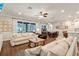Open living area with large windows, comfortable seating, and an open floor plan at 21028 Ski Way, Land O Lakes, FL 34638
