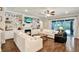 Cozy living room featuring a fireplace, custom shelving, and comfortable seating at 21028 Ski Way, Land O Lakes, FL 34638