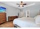 Spacious bedroom with neutral walls, ceiling fan, and two dressers at 21028 Ski Way, Land O Lakes, FL 34638