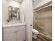 This is an updated bathroom featuring a tiled shower, modern vanity, and neutral paint at 2170 Elm St # 906, Dunedin, FL 34698