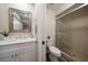 Updated bathroom with a walk-in shower, modern vanity, and contemporary fixtures at 2170 Elm St # 906, Dunedin, FL 34698