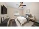 Cozy bedroom features stylish decor, a ceiling fan, and warm, inviting colors at 2170 Elm St # 906, Dunedin, FL 34698