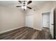 Bedroom with wood-look floors, a ceiling fan, and a closet for storing personal items at 2170 Elm St # 906, Dunedin, FL 34698