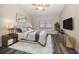 Serene bedroom with hardwood floors, a ceiling fan, and ample natural light at 2170 Elm St # 906, Dunedin, FL 34698