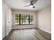 Bedroom featuring a large window offering a serene view of the outdoors at 2170 Elm St # 906, Dunedin, FL 34698
