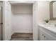 Walk-in closet is located off of the bathroom with plenty of storage space and a shelf at 2170 Elm St # 906, Dunedin, FL 34698