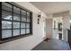 Private entrance featuring neutral stucco, security, and direct access at 2170 Elm St # 906, Dunedin, FL 34698