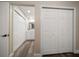 Bright hallway features closet doors and leads to an updated bathroom with modern finishes at 2170 Elm St # 906, Dunedin, FL 34698