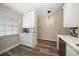 Modern kitchen featuring quartz countertops, white cabinets and stainless steel appliances at 2170 Elm St # 906, Dunedin, FL 34698