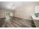 Open living room with vaulted ceiling and modern vinyl flooring at 2170 Elm St # 906, Dunedin, FL 34698