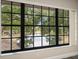 The large window offers beautiful views of the water and lush landscaping at 2170 Elm St # 906, Dunedin, FL 34698
