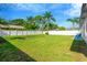 Well-maintained backyard with green grass and white privacy fence at 219 80Th Ne Ave, St Petersburg, FL 33702