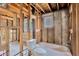 Bathroom with exposed framework featuring a partially installed toilet and bathtub at 219 80Th Ne Ave, St Petersburg, FL 33702