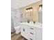 Modern bathroom with double sink vanity, framed mirrors, and white subway tile shower at 219 80Th Ne Ave, St Petersburg, FL 33702