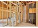 Unfinished interior featuring exposed framing, tile floors, and potential for custom renovation and design at 219 80Th Ne Ave, St Petersburg, FL 33702