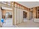 Unfinished interior showcases exposed framing, tiled floors, and potential for customized design at 219 80Th Ne Ave, St Petersburg, FL 33702