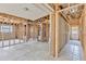 Unfinished living room with exposed beams and view into kitchen at 219 80Th Ne Ave, St Petersburg, FL 33702