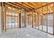 Spacious living room with exposed framework, offering potential for customization at 219 80Th Ne Ave, St Petersburg, FL 33702