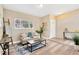 Comfortable living room featuring modern flooring, neutral tones, stylish furniture, and abundant natural light at 219 80Th Ne Ave, St Petersburg, FL 33702