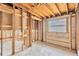 An unfinished room with exposed framework and window offering lots of natural light at 219 80Th Ne Ave, St Petersburg, FL 33702