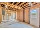Room with stud framing and a doorway, ready for renovation and customization to suit your needs at 219 80Th Ne Ave, St Petersburg, FL 33702